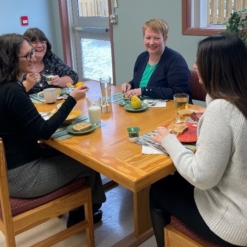 HOPE Program staff demonstrate meal support session. Closest to camera: Leah Thorne, receptionist. Clockwise: Nancy Rogers, dietitian; Cynthia Burt, intake coordinator/nurse and Kelly Yetman, occupational therapy assistant.